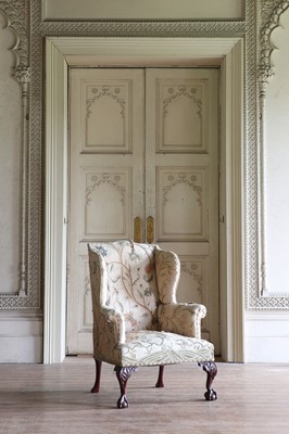 Lot 108 - A George III-style mahogany-framed wingback armchair