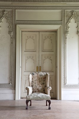 Lot 108 - A George III-style mahogany-framed wingback armchair
