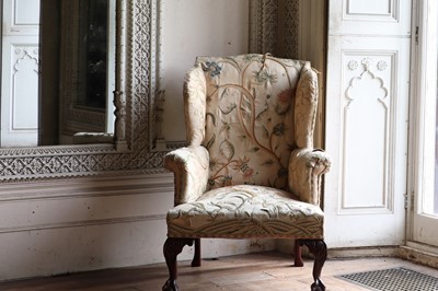 Lot 108 - A George III-style mahogany-framed wingback armchair