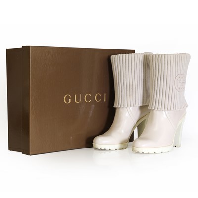 Lot 1491 - A pair of Gucci cream leather boots