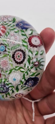 Lot 202 - A Clichy glass spaced millefiori paperweight