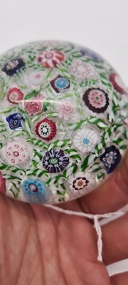 Lot 202 - A Clichy glass spaced millefiori paperweight