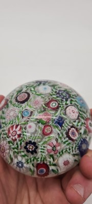 Lot 202 - A Clichy glass spaced millefiori paperweight