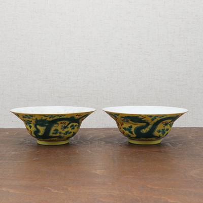 Lot 70 - A pair of Chinese yellow-ground green-enamelled bowls