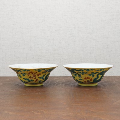 Lot 70 - A pair of Chinese yellow-ground green-enamelled bowls