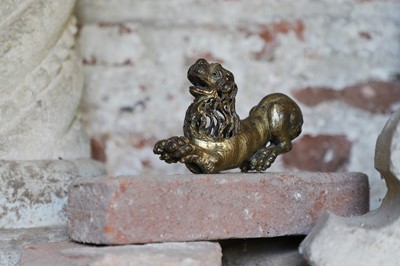 Lot 20 - A gilt-bronze recumbent lion