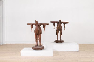 Lot 80 - A near pair of teak camel occasional tables