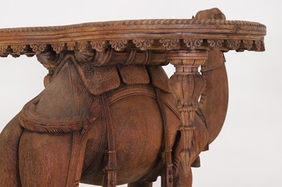 Lot 80 - A near pair of teak camel occasional tables