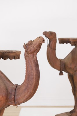 Lot 80 - A near pair of teak camel occasional tables