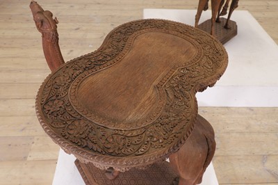 Lot 80 - A near pair of teak camel occasional tables