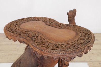 Lot 80 - A near pair of teak camel occasional tables