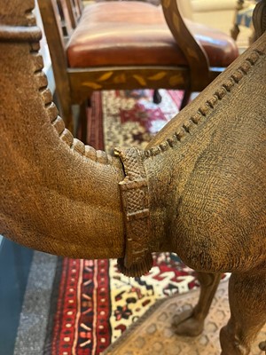 Lot 80 - A near pair of teak camel occasional tables