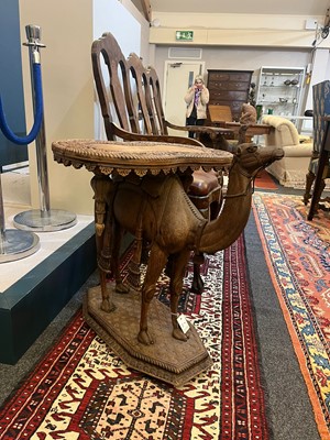 Lot 80 - A near pair of teak camel occasional tables