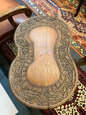 Lot 80 - A near pair of teak camel occasional tables