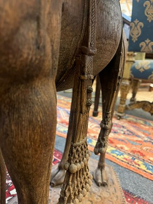 Lot 80 - A near pair of teak camel occasional tables