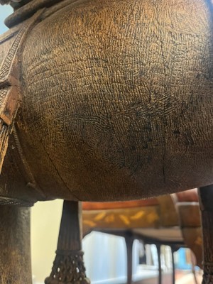 Lot 80 - A near pair of teak camel occasional tables
