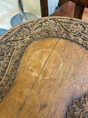 Lot 80 - A near pair of teak camel occasional tables