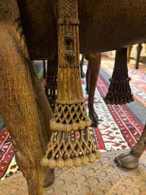 Lot 80 - A near pair of teak camel occasional tables