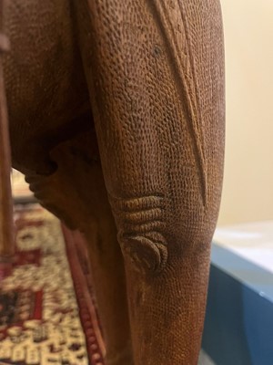 Lot 80 - A near pair of teak camel occasional tables