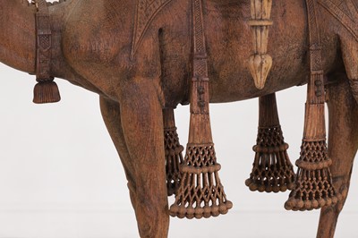 Lot 80 - A near pair of teak camel occasional tables