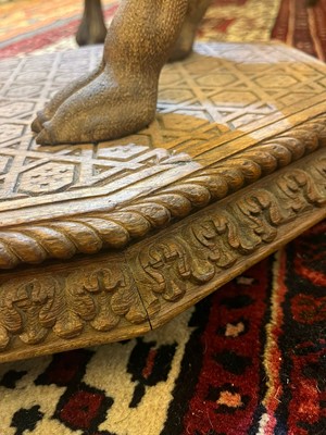 Lot 80 - A near pair of teak camel occasional tables