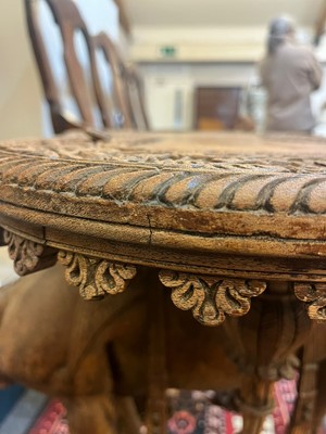Lot 80 - A near pair of teak camel occasional tables
