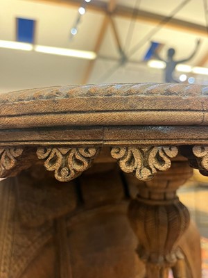 Lot 80 - A near pair of teak camel occasional tables