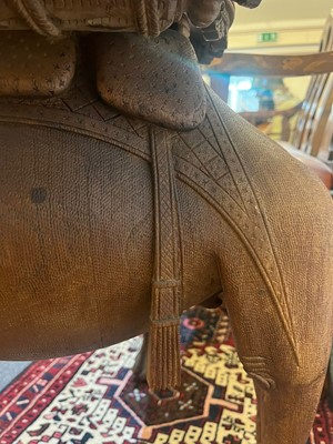 Lot 80 - A near pair of teak camel occasional tables