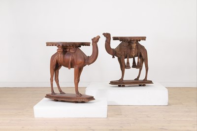 Lot 80 - A near pair of teak camel occasional tables
