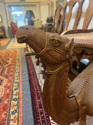 Lot 80 - A near pair of teak camel occasional tables