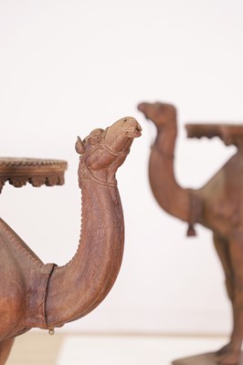 Lot 80 - A near pair of teak camel occasional tables