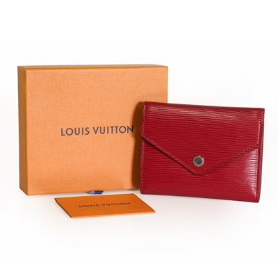 Lot 1485 - A Louis Vuitton fuschia Victorine wallet
