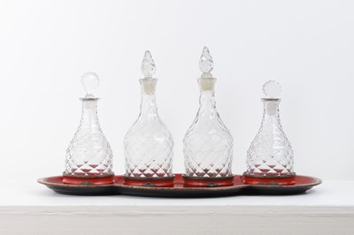 Lot 265 - A Regency toleware tray and a set of glass decanters
