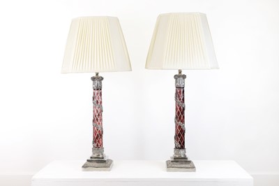 Lot 197 - A pair of red glass and metal-mounted column lamps