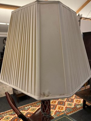 Lot 197 - A pair of red glass and metal-mounted column lamps