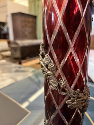 Lot 197 - A pair of red glass and metal-mounted column lamps