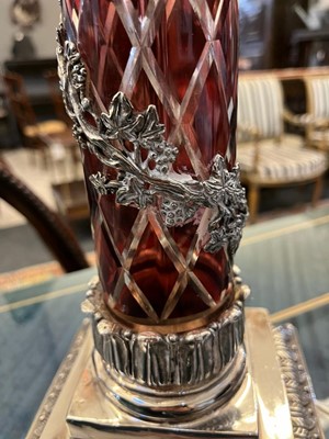 Lot 197 - A pair of red glass and metal-mounted column lamps