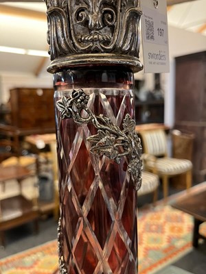 Lot 197 - A pair of red glass and metal-mounted column lamps