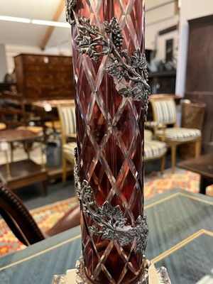 Lot 197 - A pair of red glass and metal-mounted column lamps