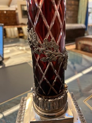 Lot 197 - A pair of red glass and metal-mounted column lamps