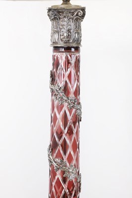 Lot 197 - A pair of red glass and metal-mounted column lamps