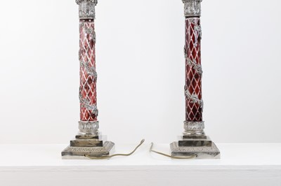 Lot 197 - A pair of red glass and metal-mounted column lamps