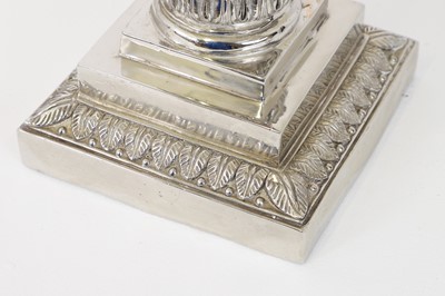 Lot 197 - A pair of red glass and metal-mounted column lamps