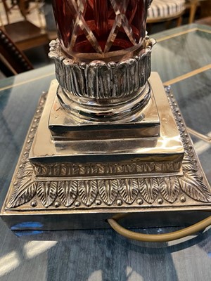 Lot 197 - A pair of red glass and metal-mounted column lamps