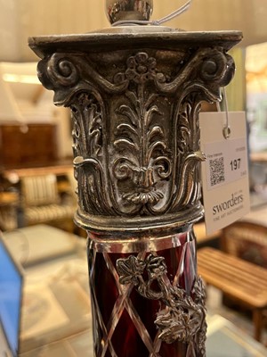 Lot 197 - A pair of red glass and metal-mounted column lamps