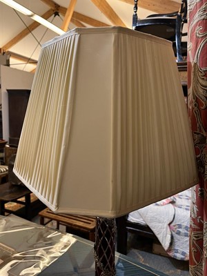 Lot 197 - A pair of red glass and metal-mounted column lamps
