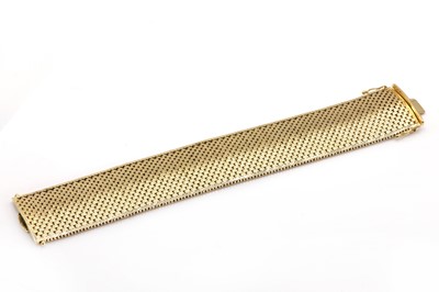 Lot 61 - A 14ct gold nine row panther link bracelet, c.1975