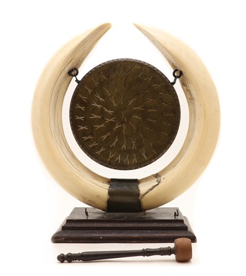 Lot 352 - A Rowland Ward hippopotamus teeth dinner gong