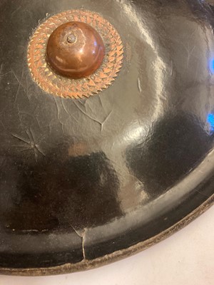 Lot 146 - A lacquered hide shield