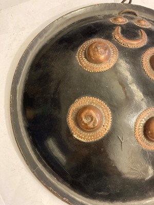 Lot 146 - A lacquered hide shield